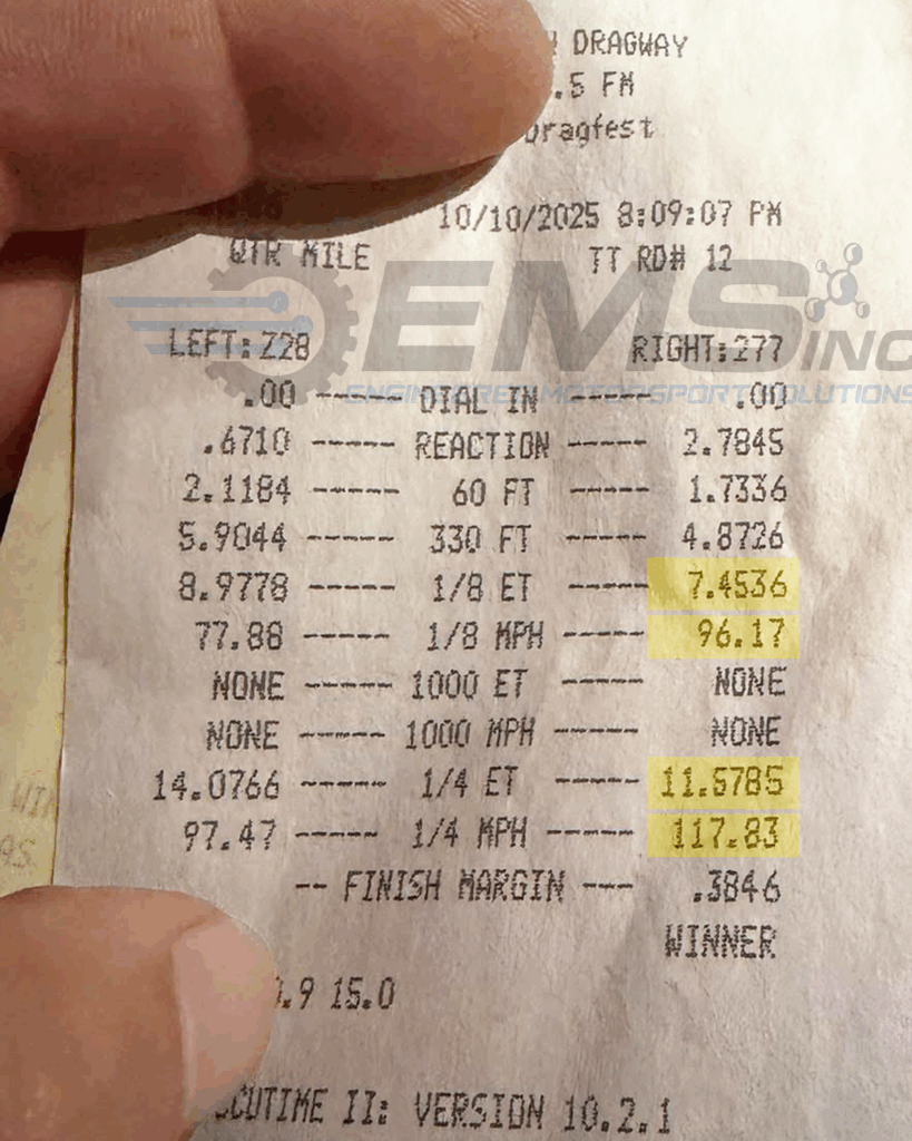 This image shows an official track time slip documenting the Engineered Motorsport Solutions (EMS) S650 EcoBoost Mustang’s performance at the drag strip. The slip, dated October 10, 2025, records the car’s results during a quarter-mile run tuned by Ryan at EMS. The highlighted numbers indicate an eighth-mile time of 7.45 seconds at 96.17 mph and a quarter-mile time of 11.57 seconds at 117.83 mph. The purpose of this image is to provide verified proof of the vehicle’s real-world performance achieved with EMS’s custom tuning, demonstrating both the speed and consistency of the newly released S650 EcoBoost tuning package.